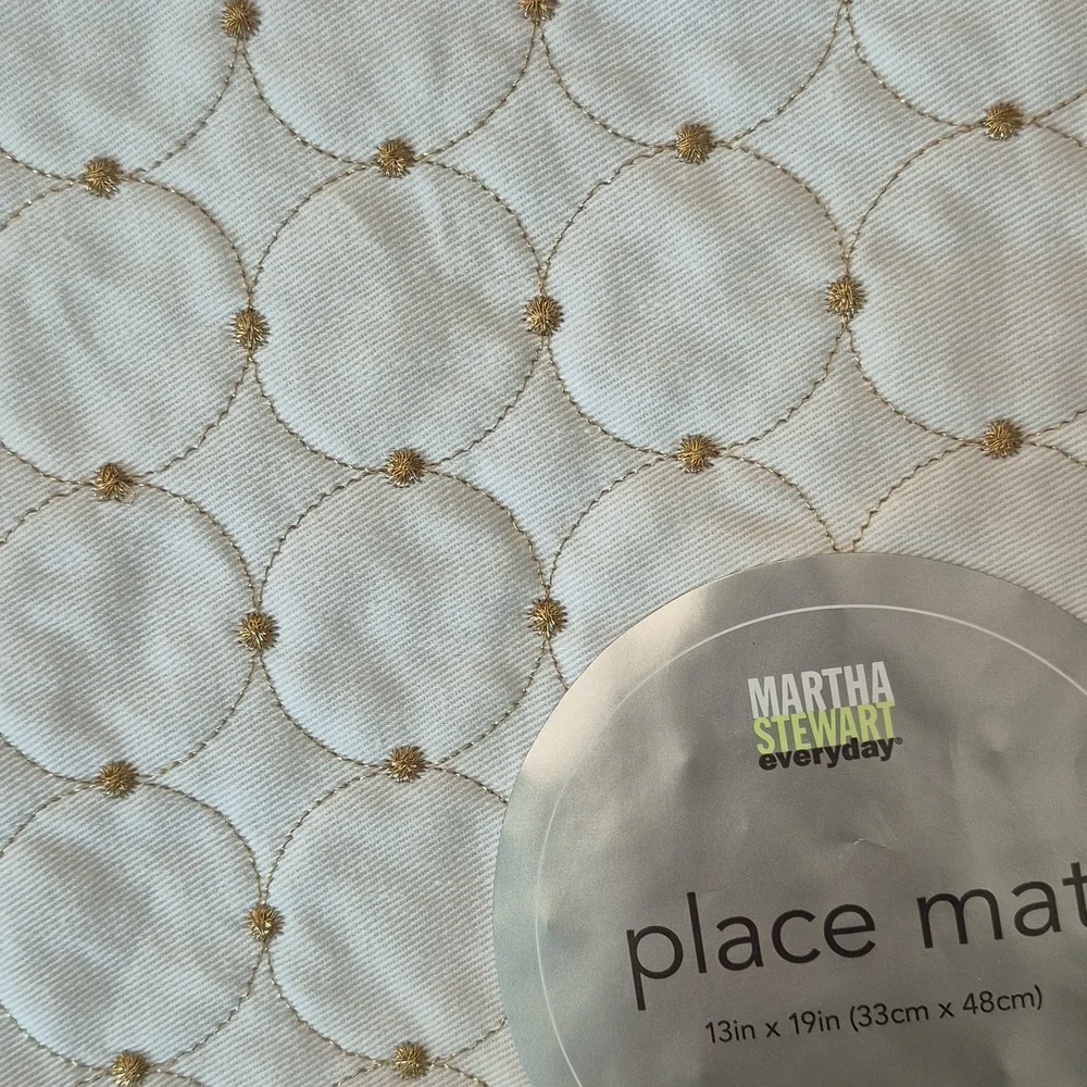 4 Martha Stewart gold sparkle and cream placemats. New from 2008